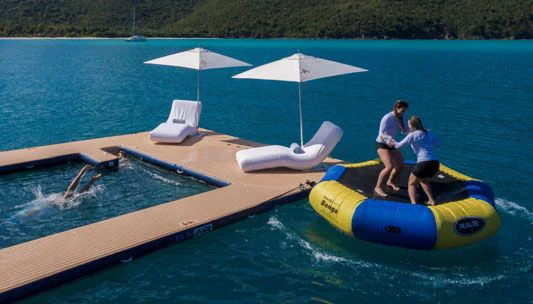 a couple of people on a raft aboard SCOTT FREE Yacht for Charter