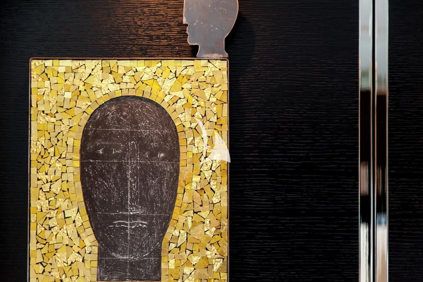 a stone sculpture on a wall aboard SCOTT FREE Yacht for Charter