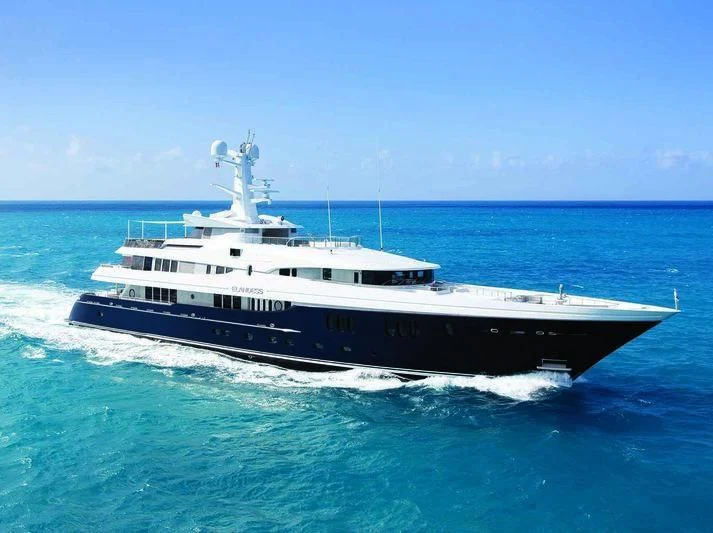 a large white boat in the water aboard SCOTT FREE Yacht for Charter