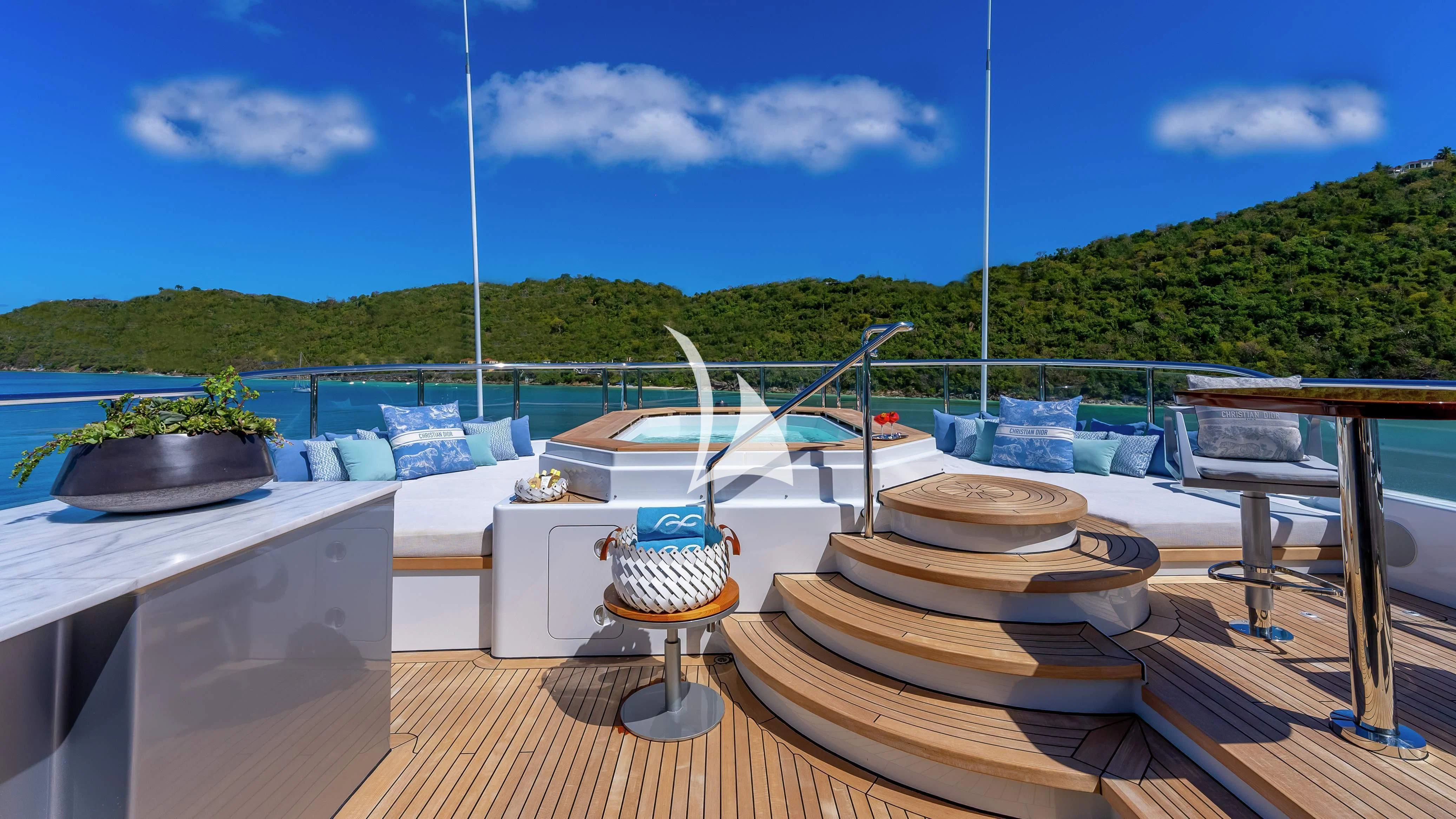 a deck with a table and chairs on it aboard SCOTT FREE Yacht for Charter