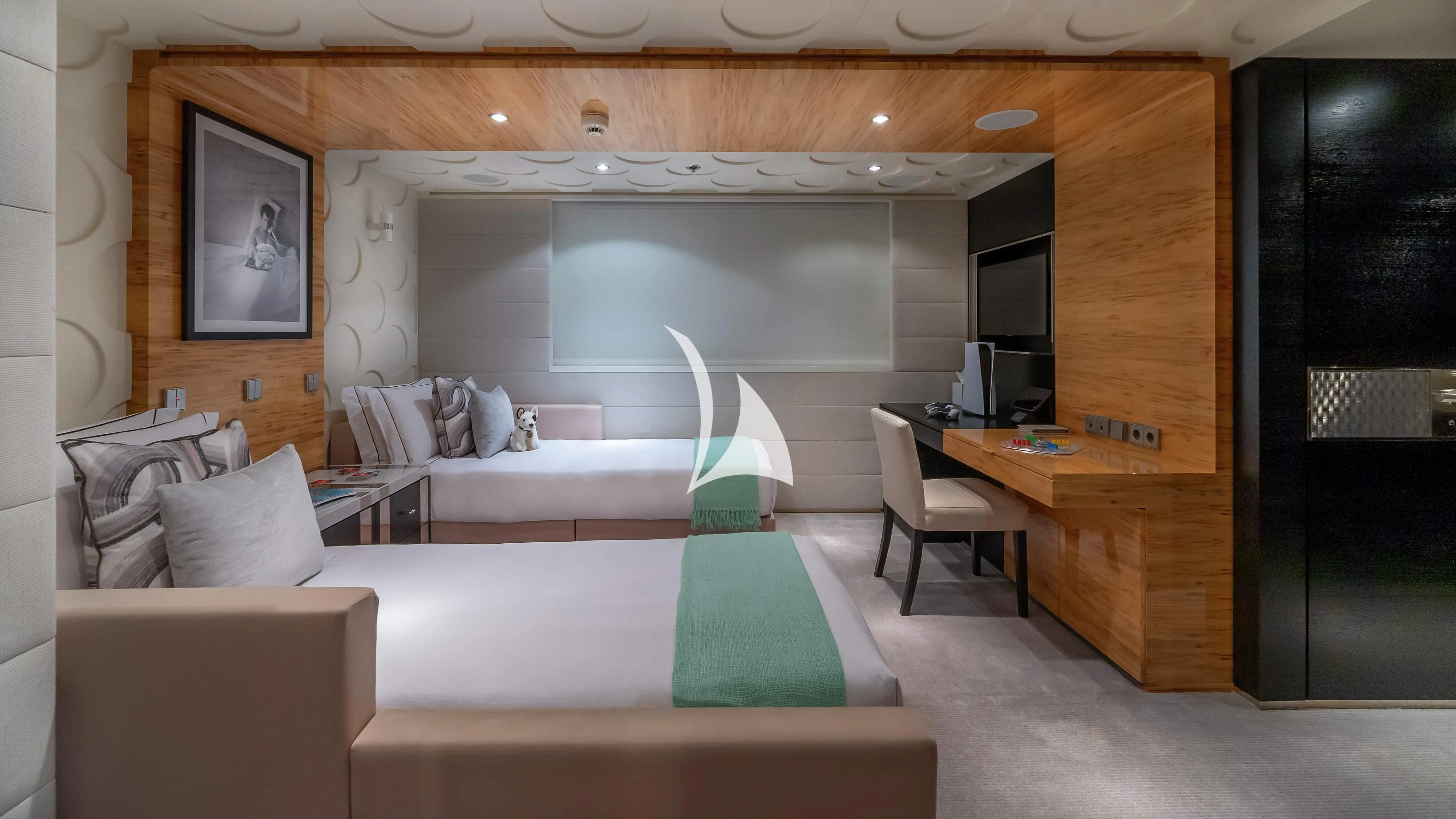 a room with a bed and a desk aboard SCOTT FREE Yacht for Charter