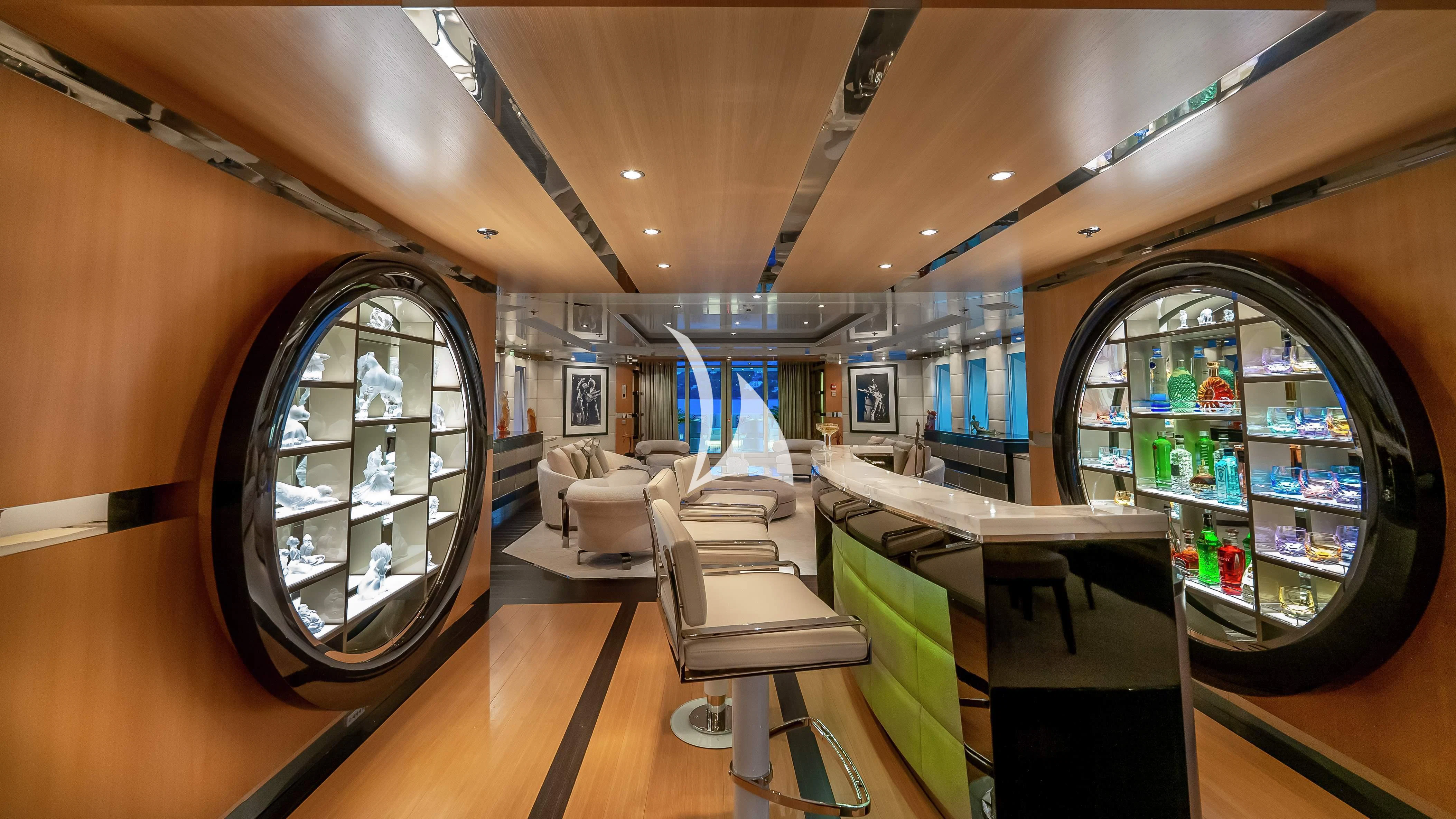 inside of a building with a large mirror and a table and chairs aboard SCOTT FREE Yacht for Charter