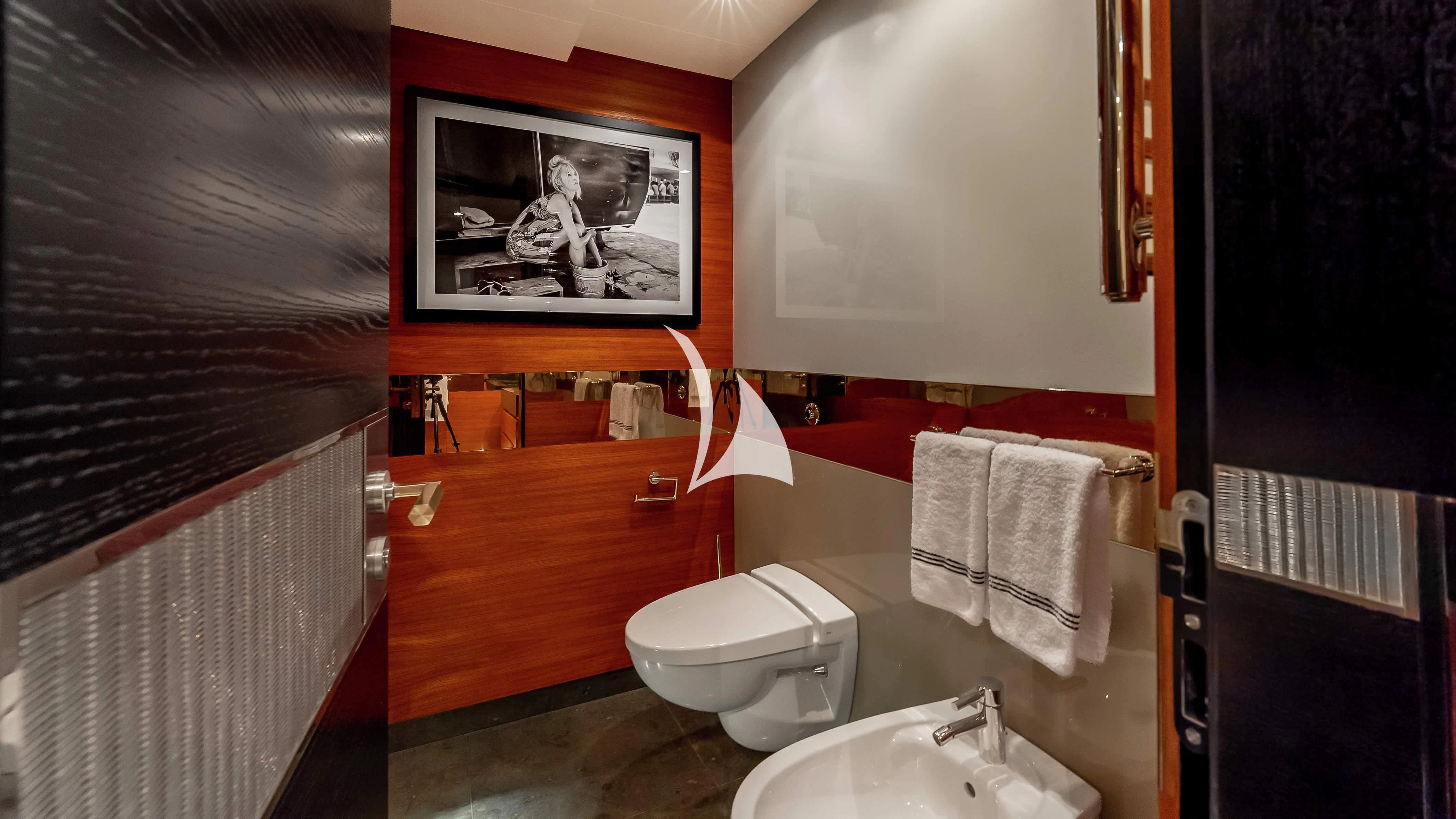a bathroom with a toilet and sink aboard SCOTT FREE Yacht for Charter