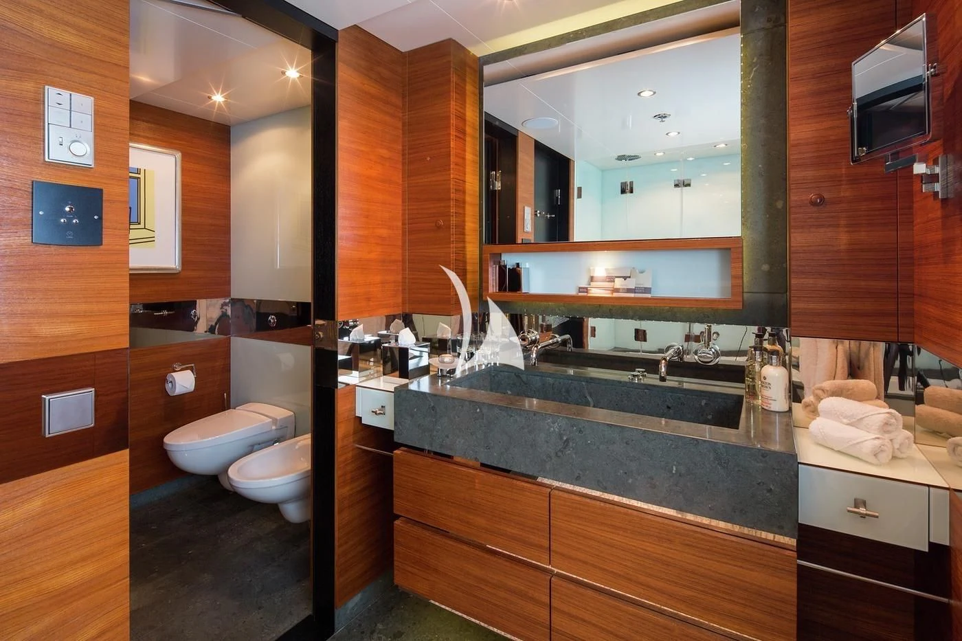 a bathroom with a large mirror aboard SCOTT FREE Yacht for Charter