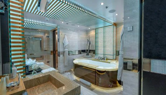 a bathroom with a large mirror aboard SCOTT FREE Yacht for Charter