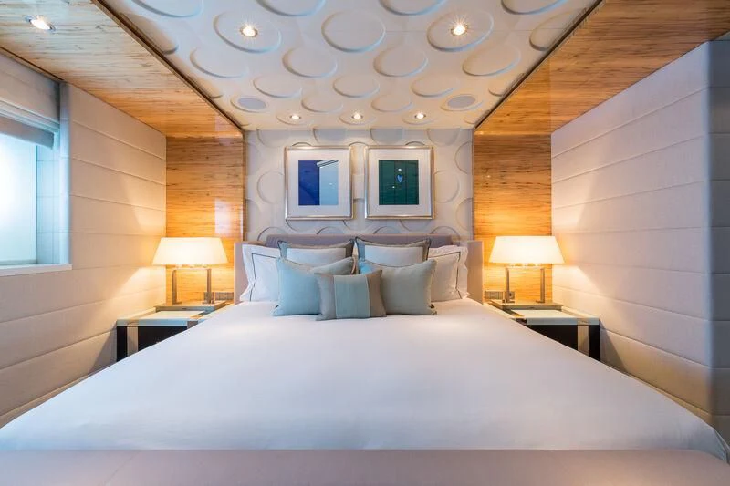 a bed with a white sheet aboard SCOTT FREE Yacht for Charter
