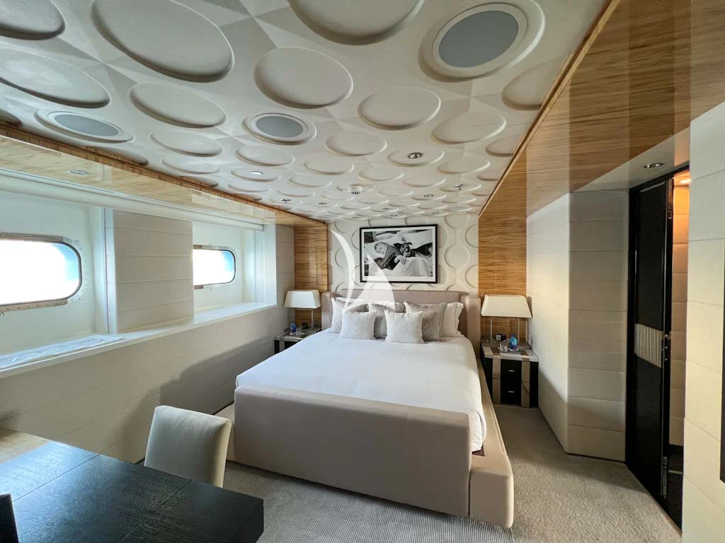 a room with a bed and a table aboard SCOTT FREE Yacht for Charter