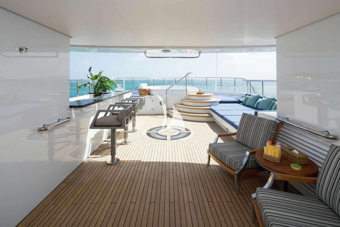 a room with a table chairs and a couch aboard SCOTT FREE Yacht for Charter