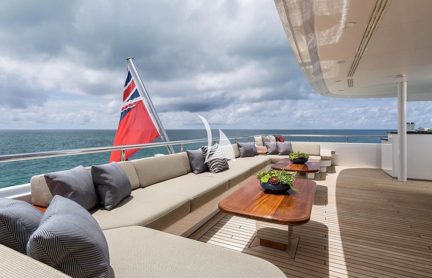 a large lounge chair on a deck overlooking the ocean aboard SCOTT FREE Yacht for Charter