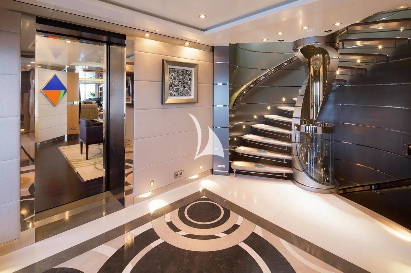 a large room with a staircase and a glass door aboard SCOTT FREE Yacht for Charter