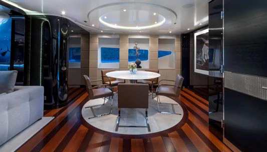 a room with a table and chairs aboard SCOTT FREE Yacht for Charter