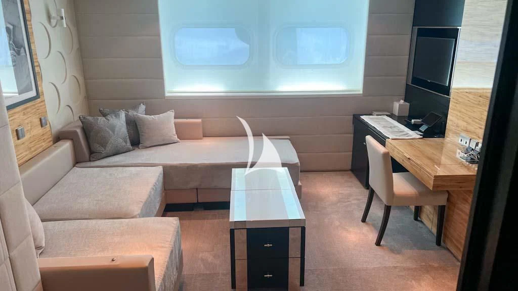 a living room with a couch and a table aboard SCOTT FREE Yacht for Charter