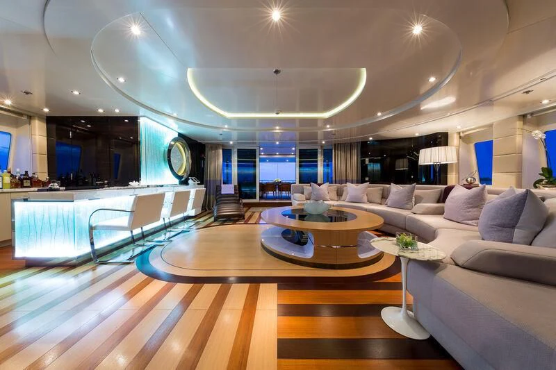 a living room with a large table and couches aboard SCOTT FREE Yacht for Charter