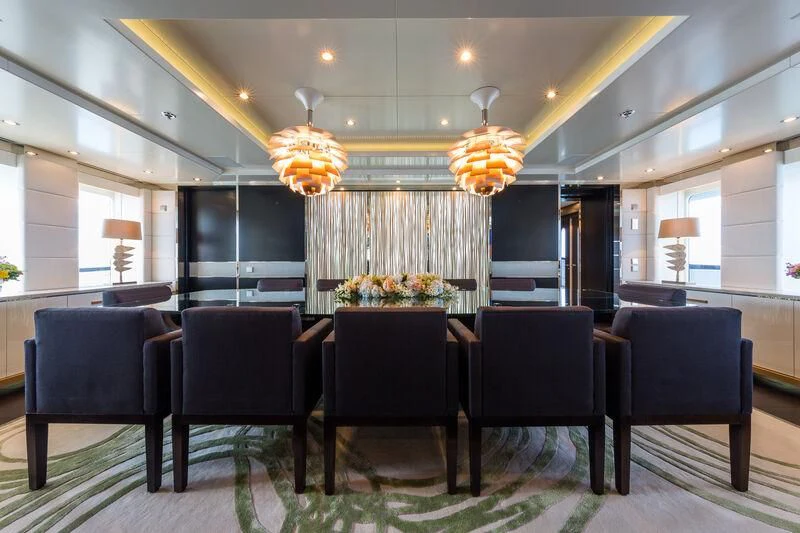 a large room with chairs and a table aboard SCOTT FREE Yacht for Charter