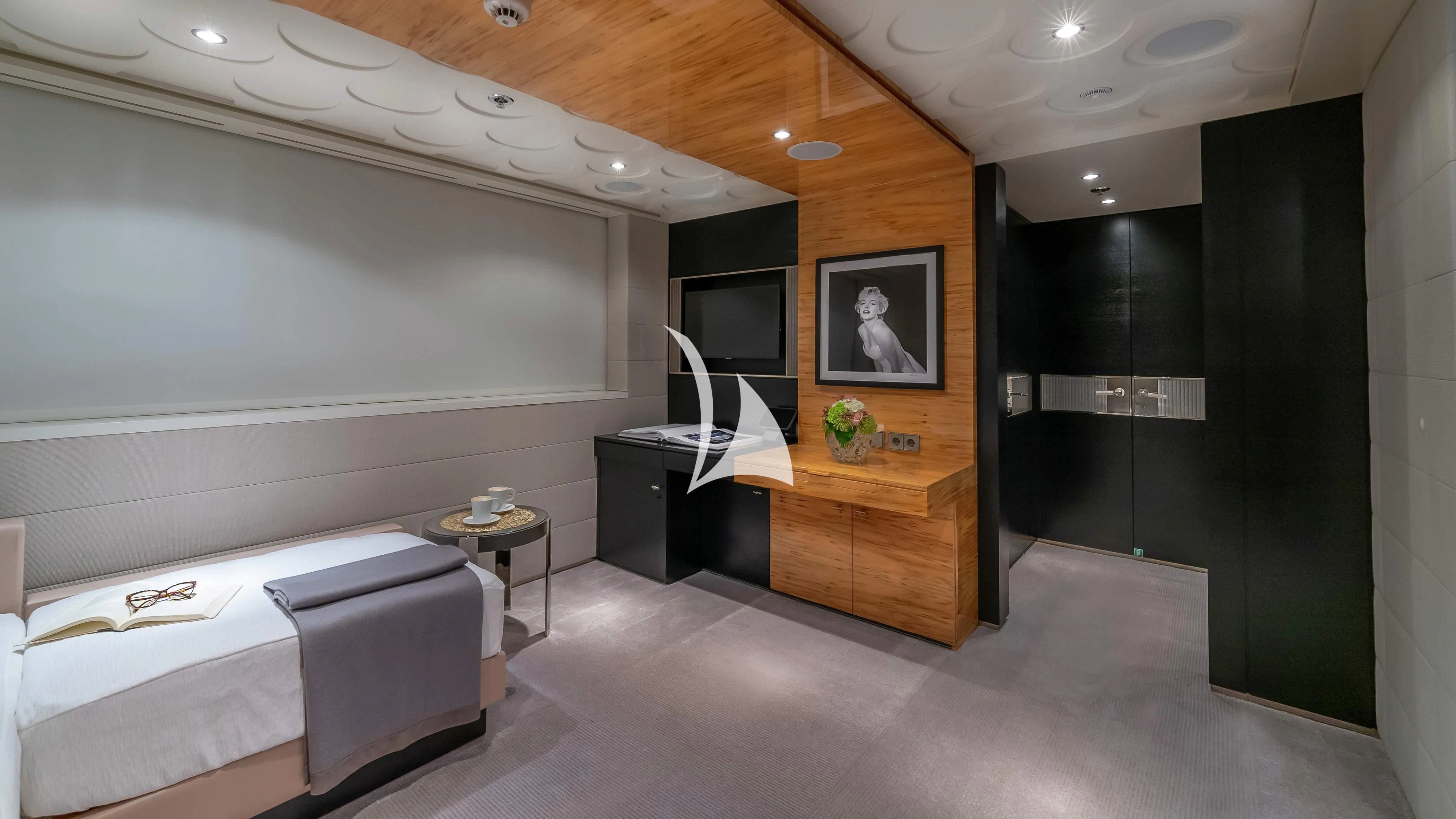 a room with a bed and a desk aboard SCOTT FREE Yacht for Charter