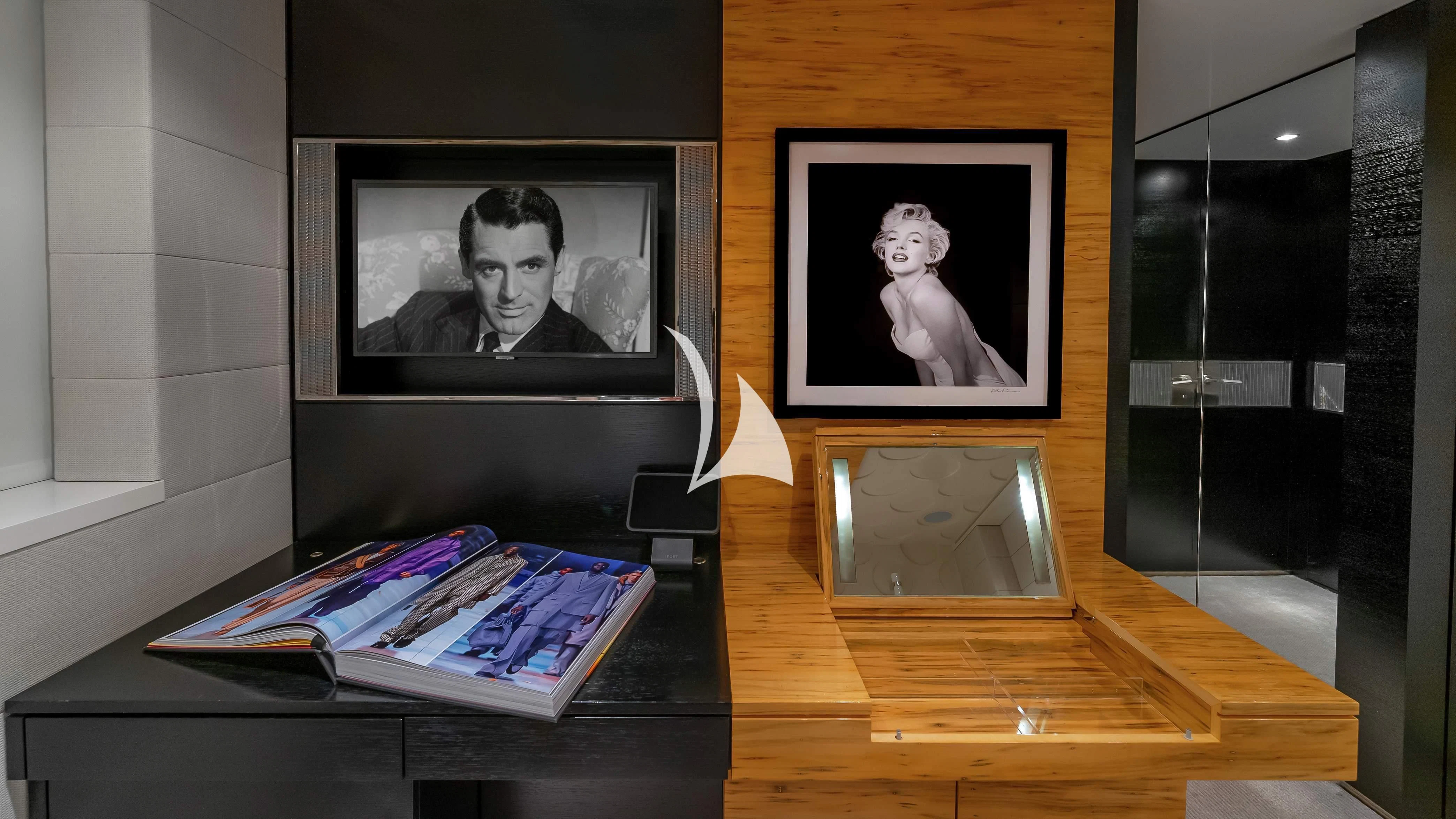 a desk with a television and a picture on it aboard SCOTT FREE Yacht for Charter