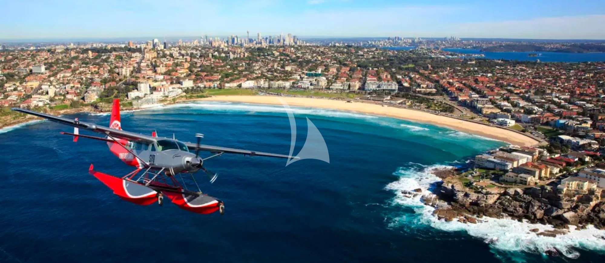 a plane flying over a city aboard GHOST II Yacht for Sale