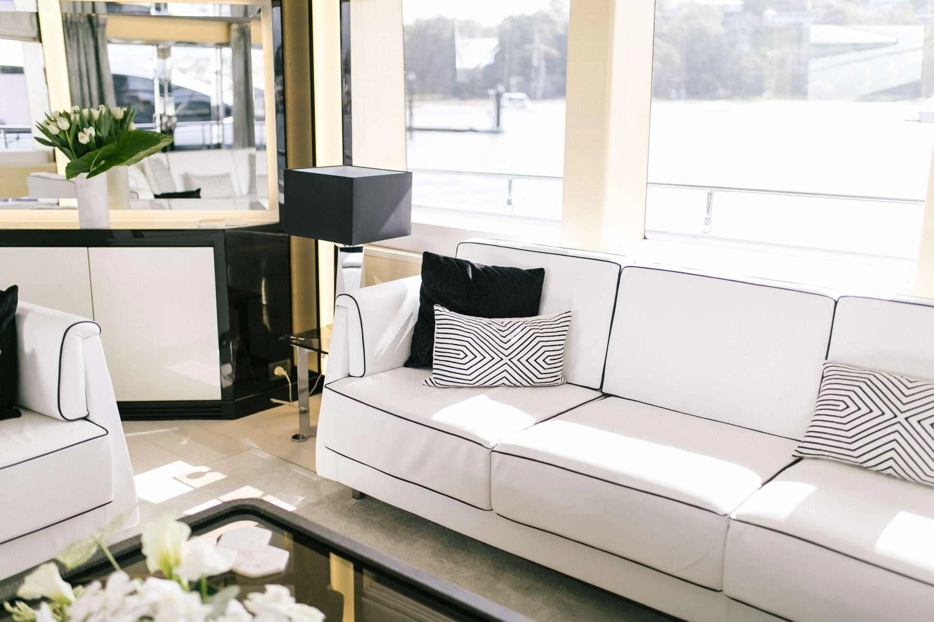 a white couch with pillows aboard GHOST II Yacht for Sale