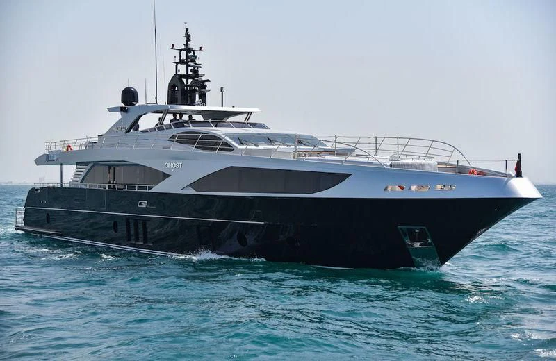 a large ship in the water aboard GHOST II Yacht for Sale