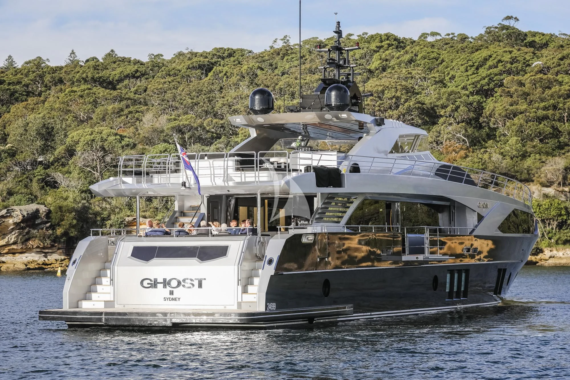 a large white boat in the water aboard GHOST II Yacht for Sale