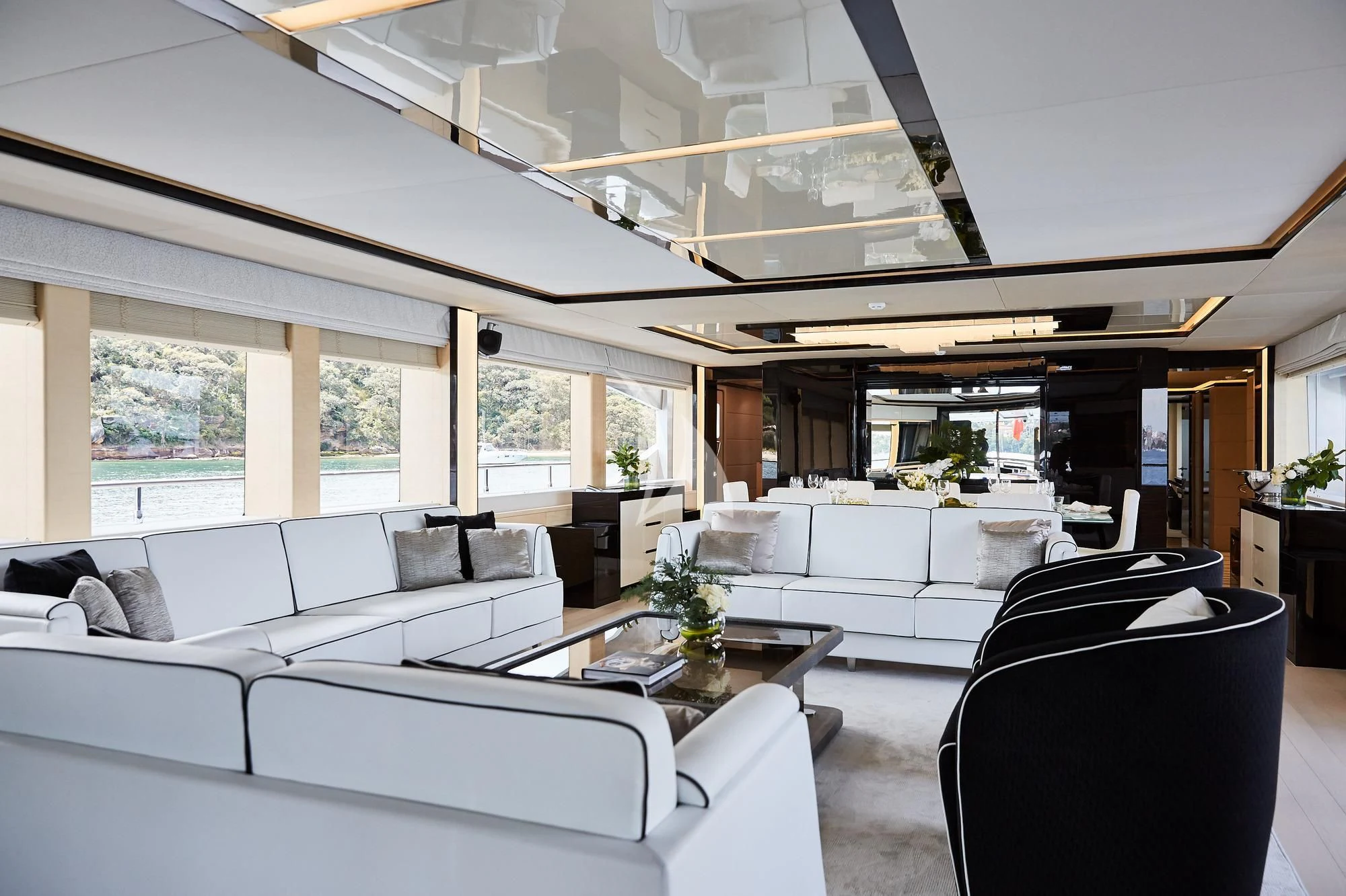 a room with white furniture aboard GHOST II Yacht for Sale