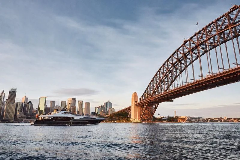 a large bridge over a body of water with a boat in it aboard GHOST II Yacht for Sale