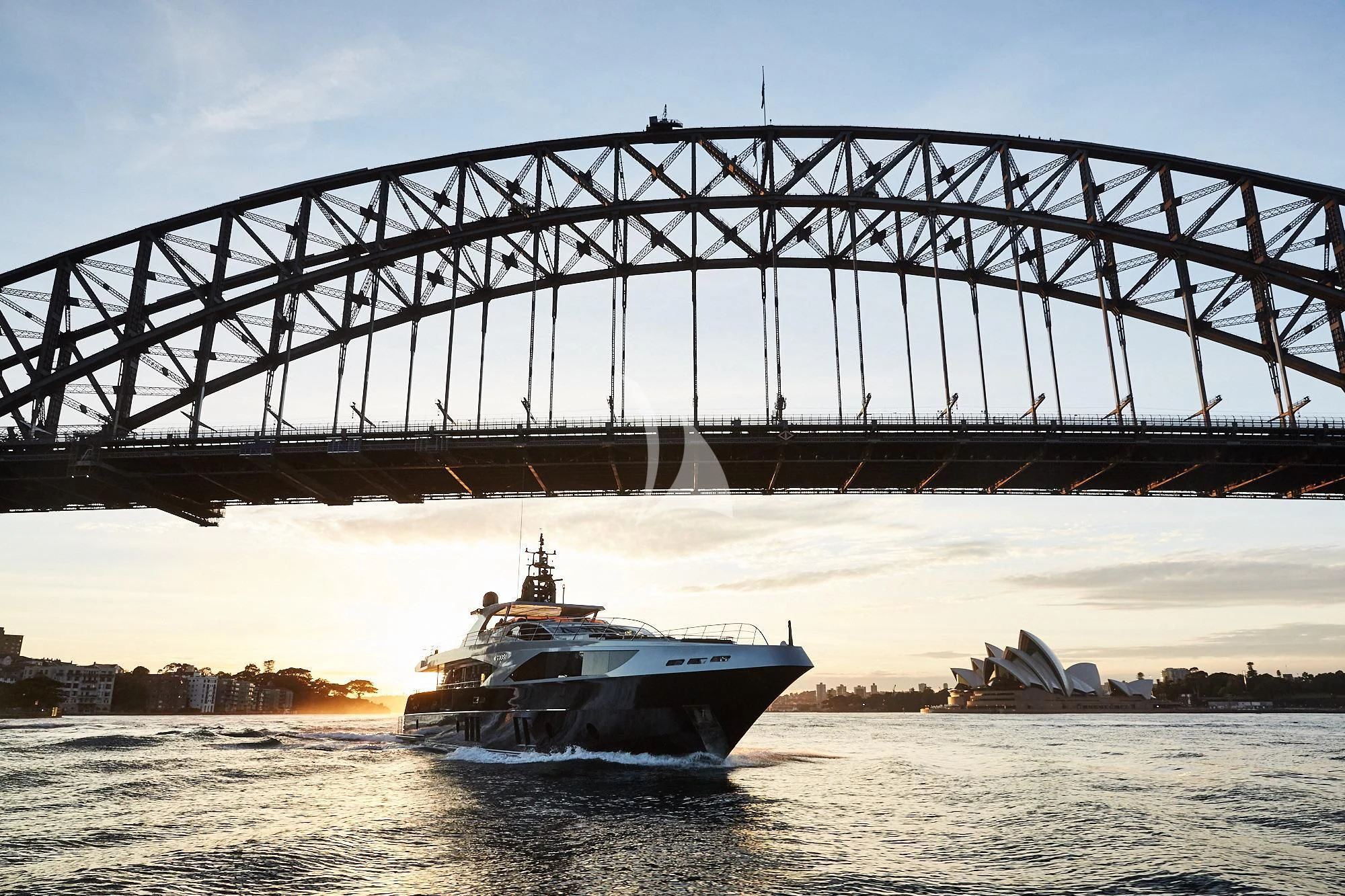 a boat under a bridge aboard GHOST II Yacht for Sale