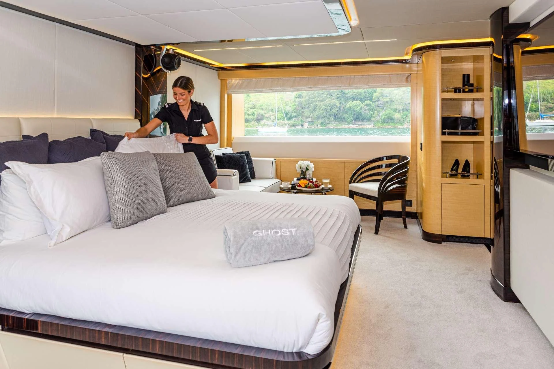 a person sitting on a bed aboard GHOST II Yacht for Sale