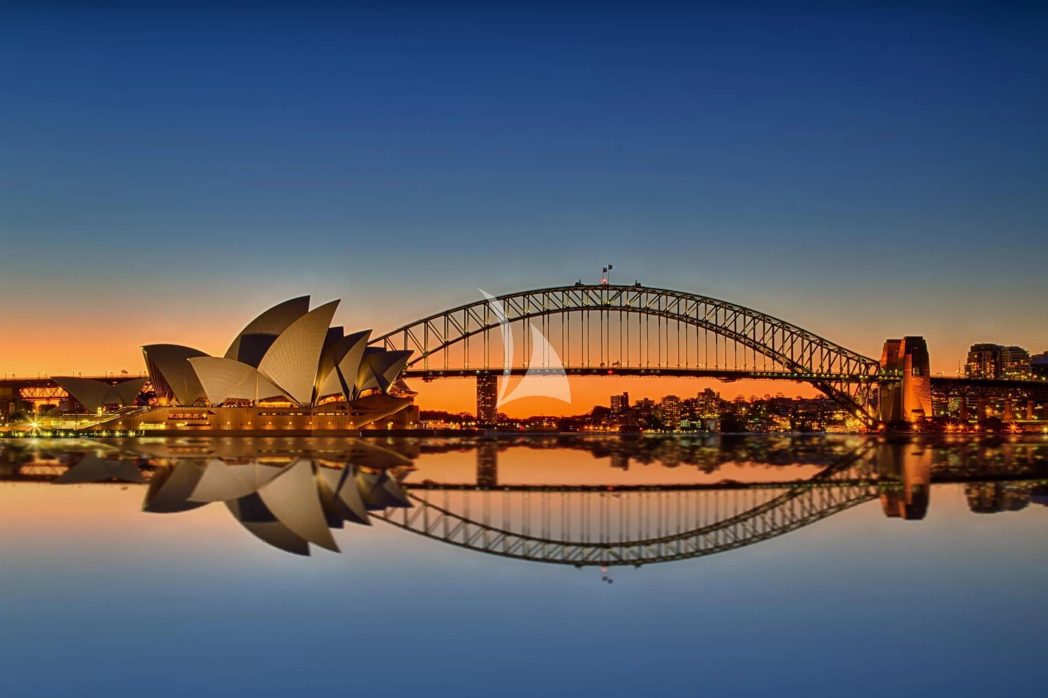 a bridge over water with a city in the background aboard GHOST II Yacht for Sale
