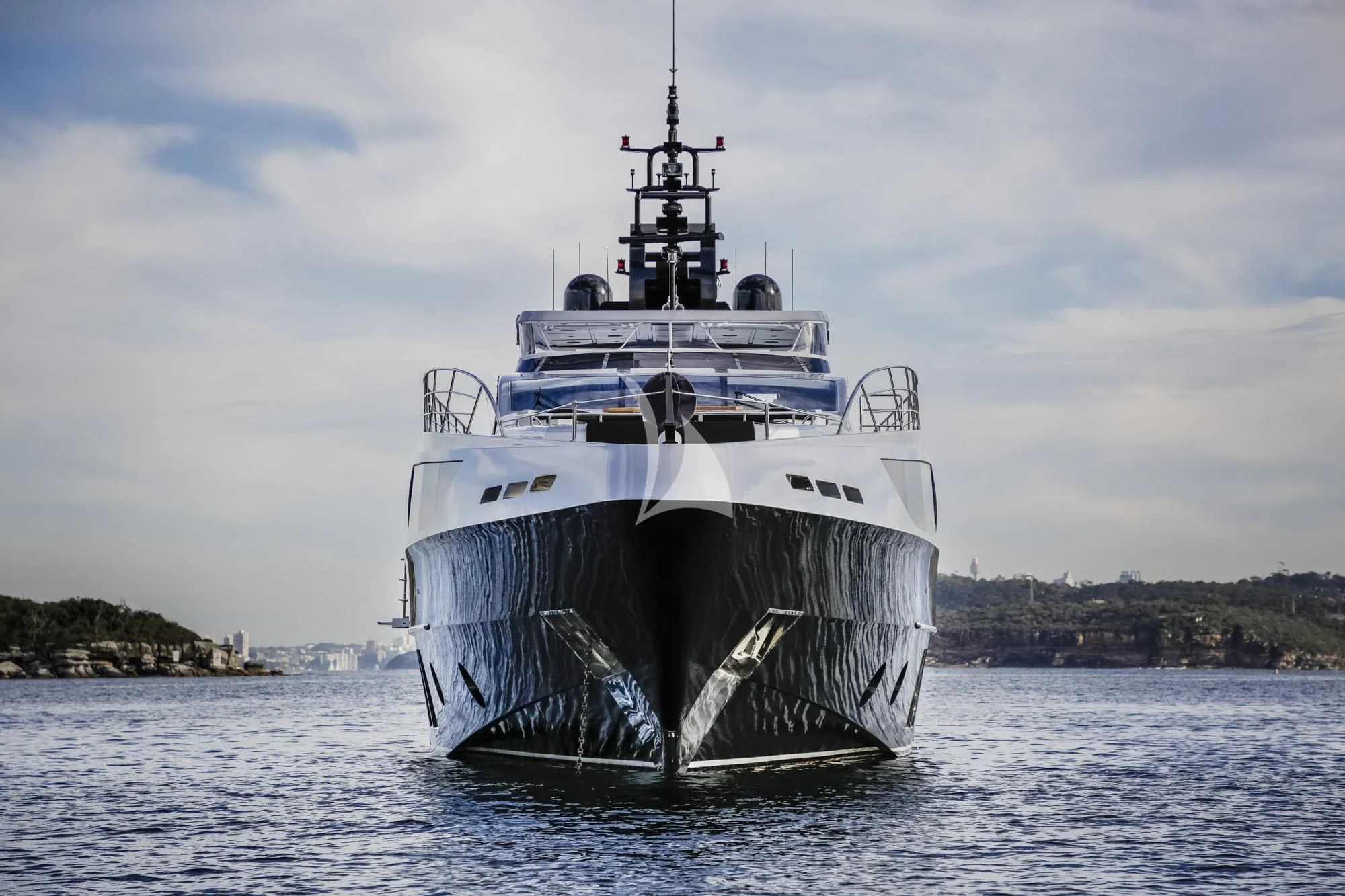 a large ship in the water aboard GHOST II Yacht for Sale