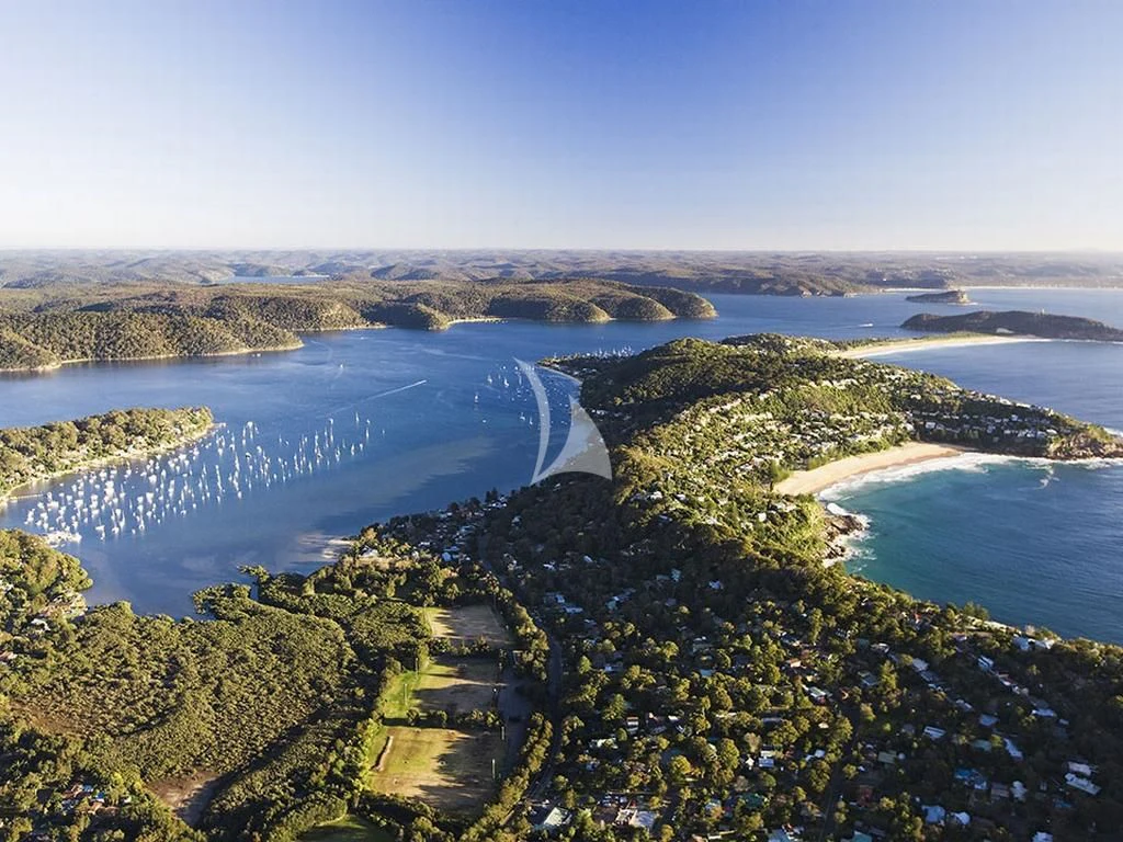 a road with a body of water and trees around it aboard GHOST II Yacht for Sale
