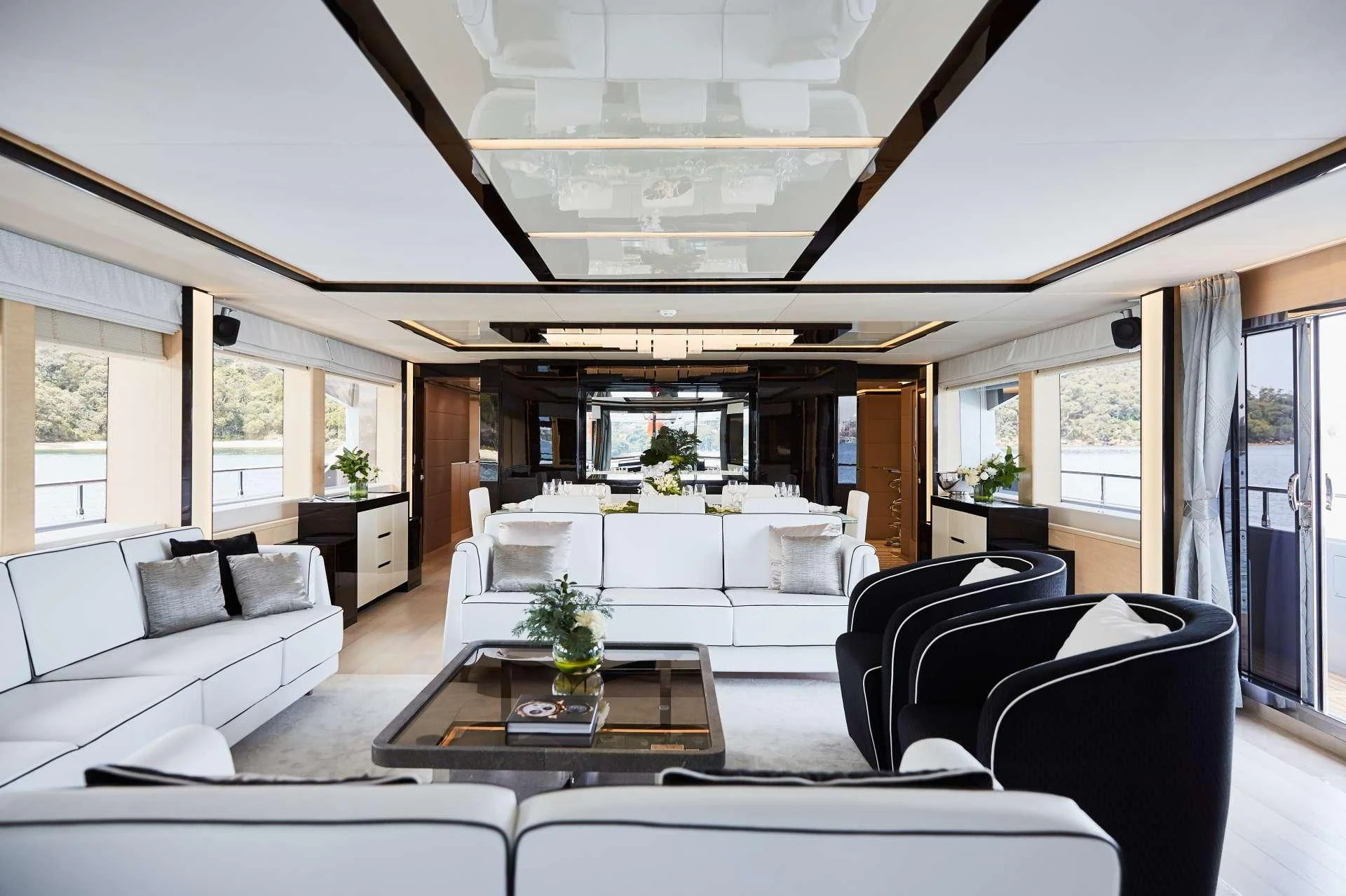 a living room with a large open window aboard GHOST II Yacht for Sale