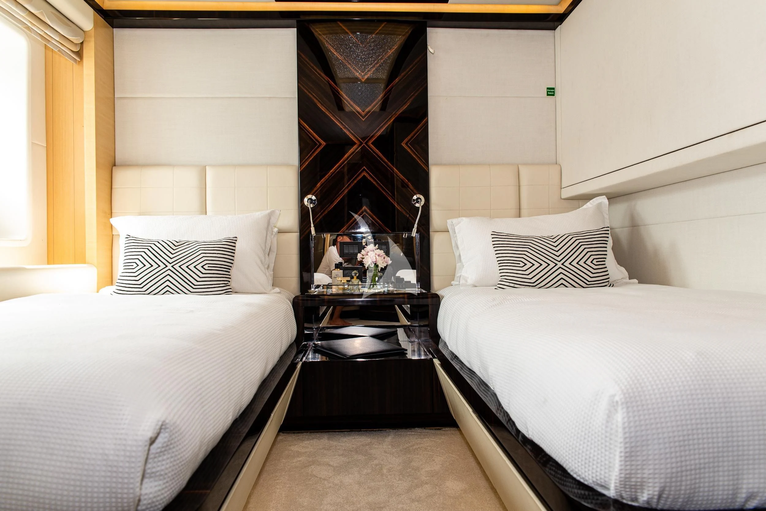 a room with two beds aboard GHOST II Yacht for Sale