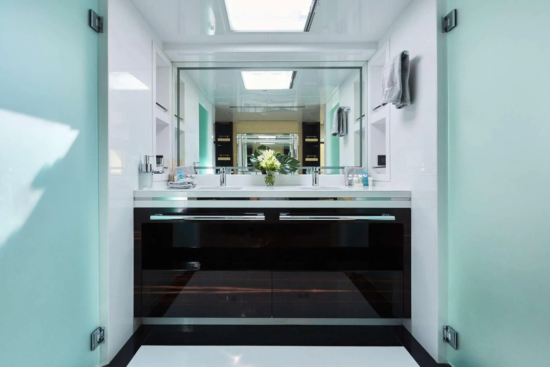 a bathroom with a black countertop aboard GHOST II Yacht for Sale