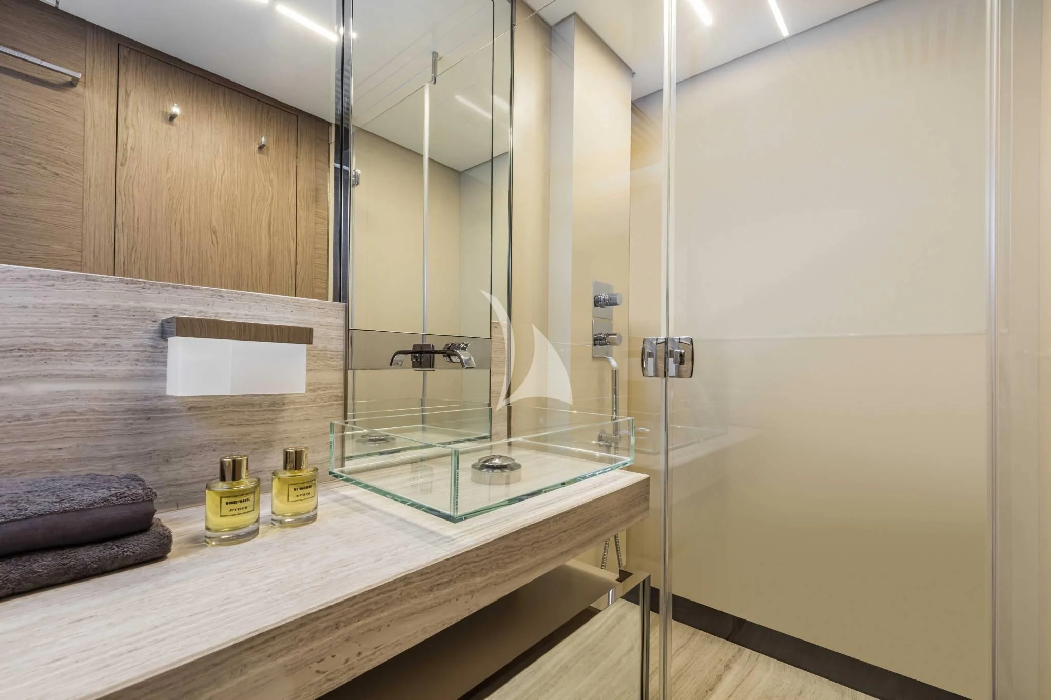 a bathroom with a glass shower aboard PIOLA Yacht for Sale