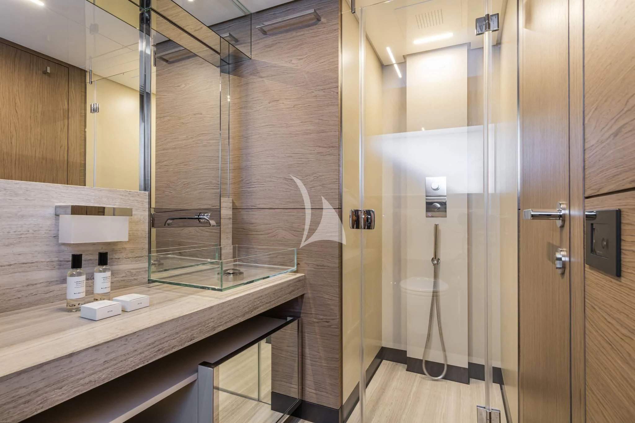 a bathroom with a glass shower aboard PIOLA Yacht for Sale