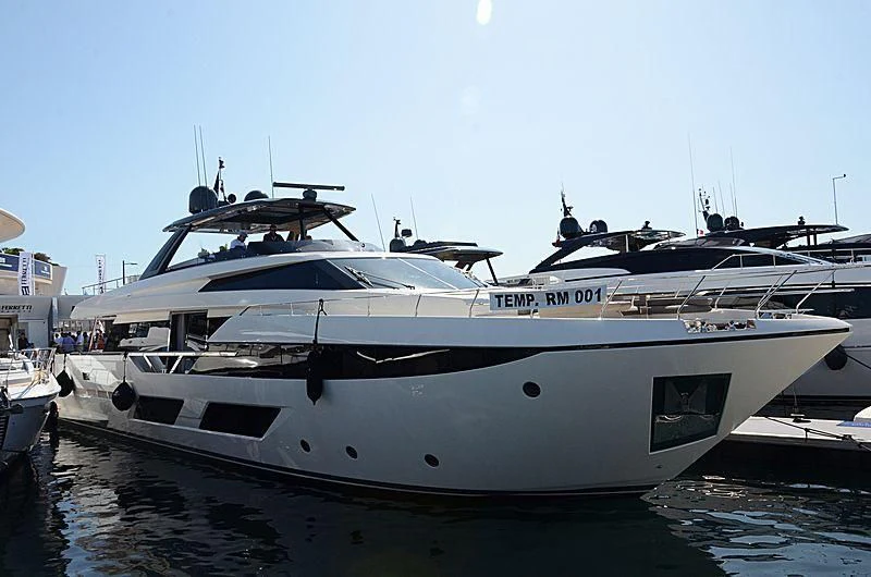 a white yacht in a harbor aboard PIOLA Yacht for Sale