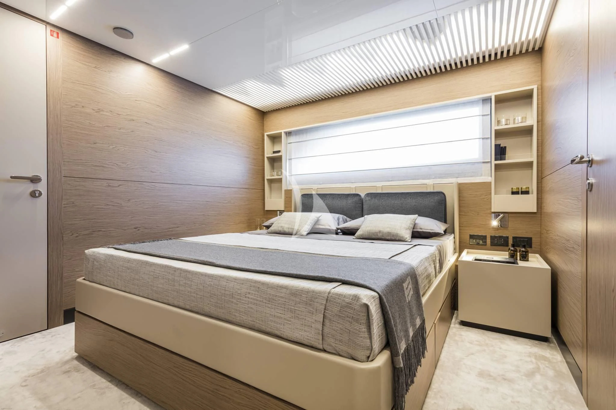 a room with a bed and a shelf aboard PIOLA Yacht for Sale