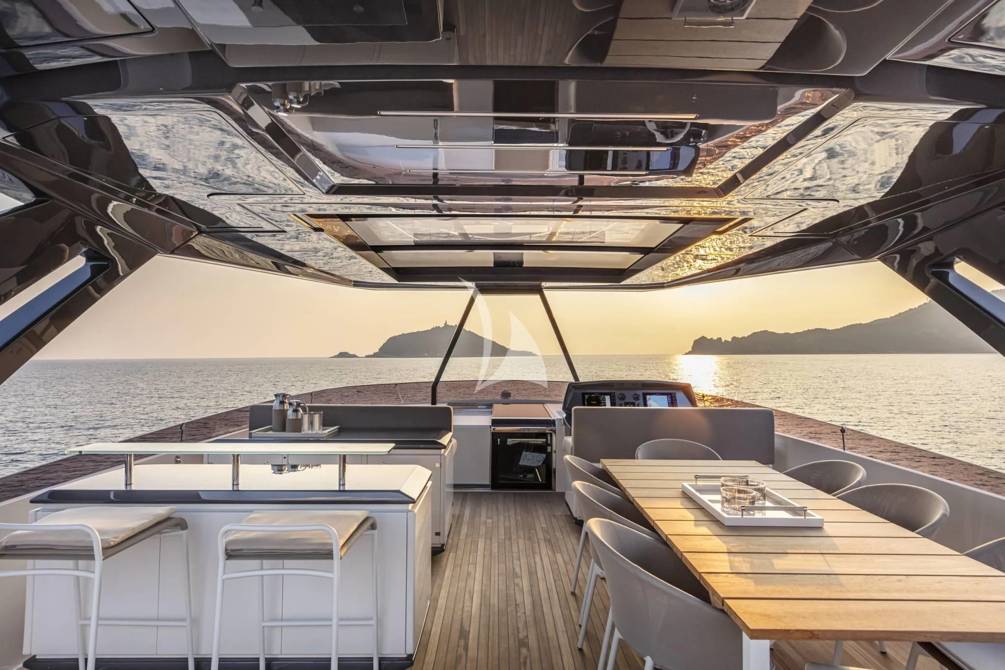 a boat with a table and chairs aboard PIOLA Yacht for Sale