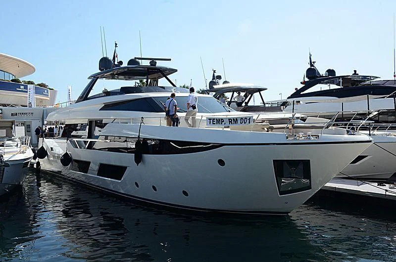 a couple of people walking on a boat in the water aboard PIOLA Yacht for Sale