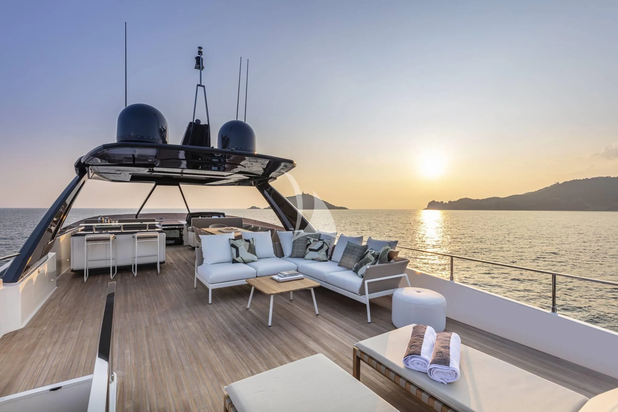 a deck with a pool and a table on it aboard PIOLA Yacht for Sale