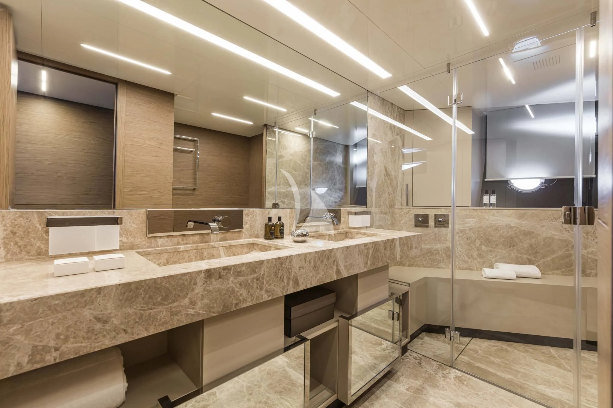 a bathroom with a countertop sink and a large mirror aboard PIOLA Yacht for Sale