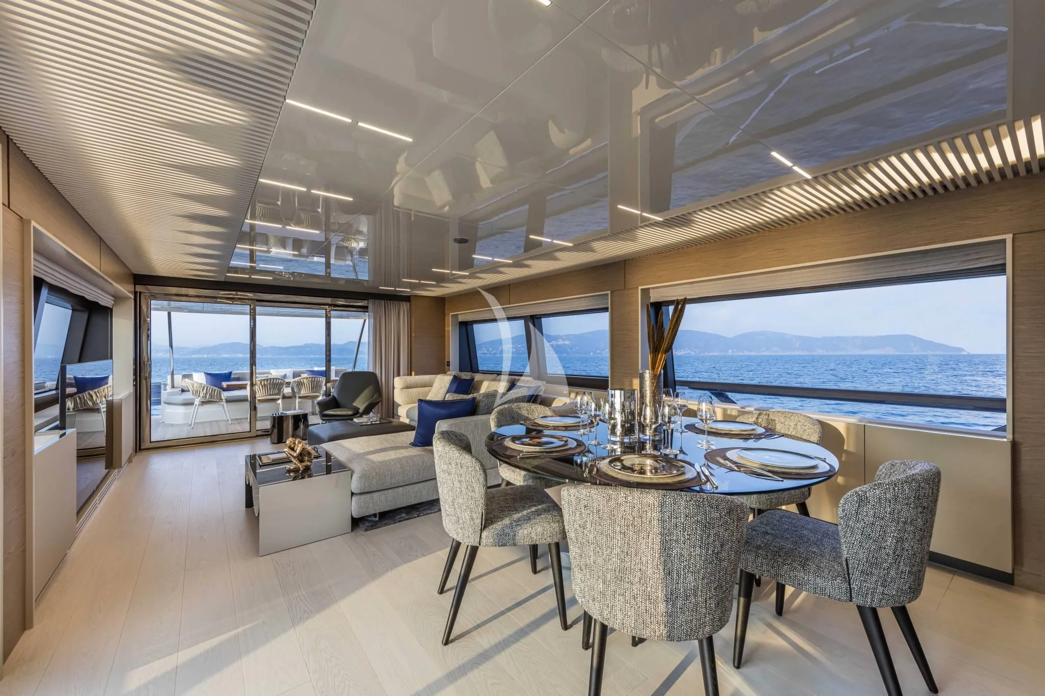 a large dining room with a large window aboard PIOLA Yacht for Sale