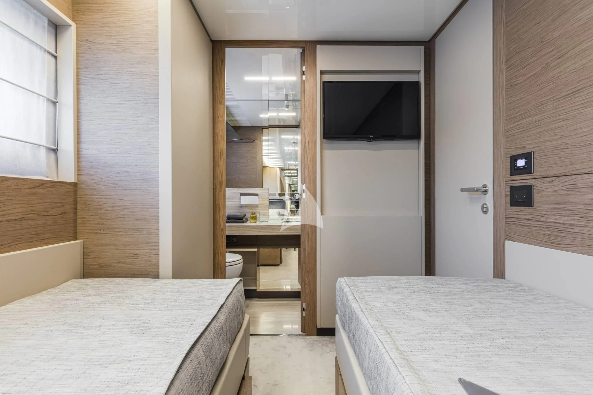 a room with a bed and a table aboard PIOLA Yacht for Sale