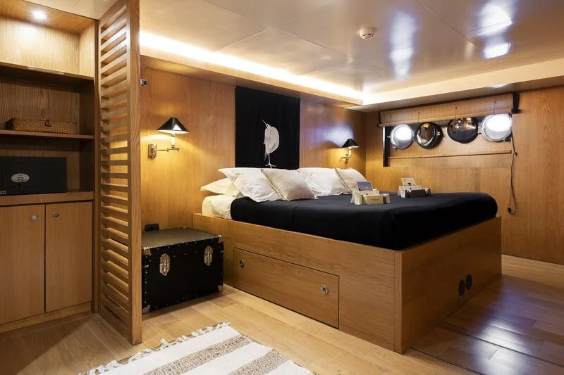 a large bedroom with a large bed aboard SOUNION II Yacht for Sale