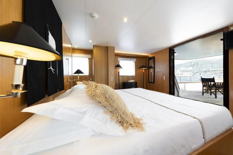 a bed with a white sheet aboard SOUNION II Yacht for Sale