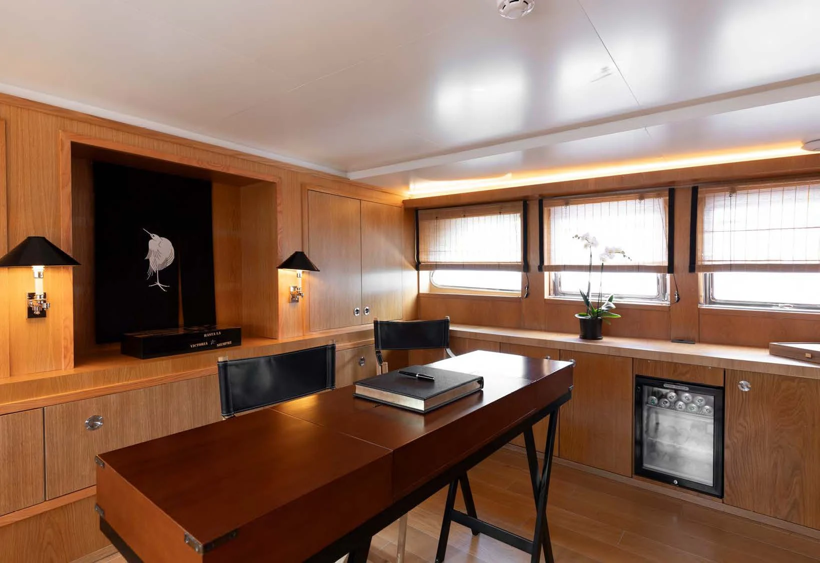 a room with a table and chairs aboard SOUNION II Yacht for Sale
