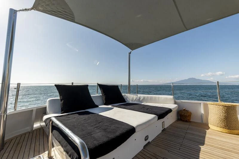 a bed on a deck aboard SOUNION II Yacht for Sale
