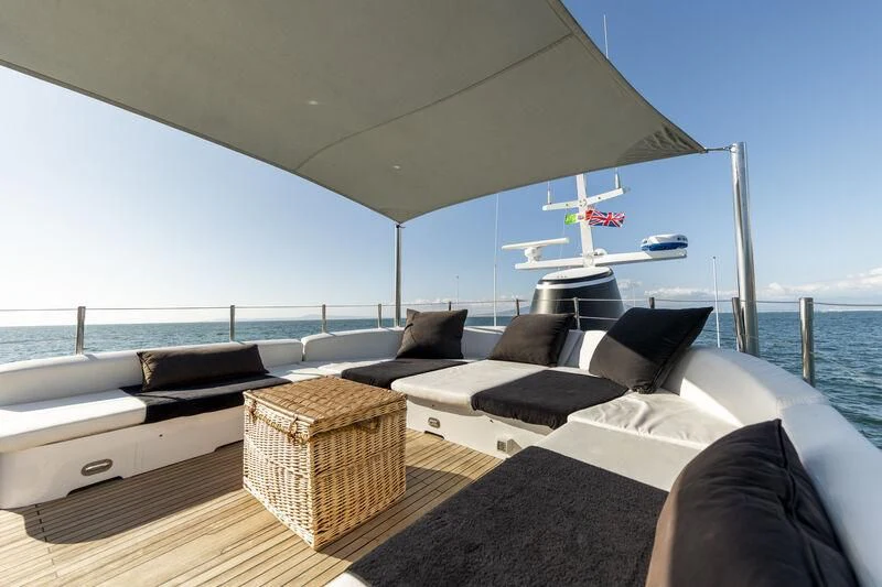 a large living room with a large window overlooking the ocean aboard SOUNION II Yacht for Sale