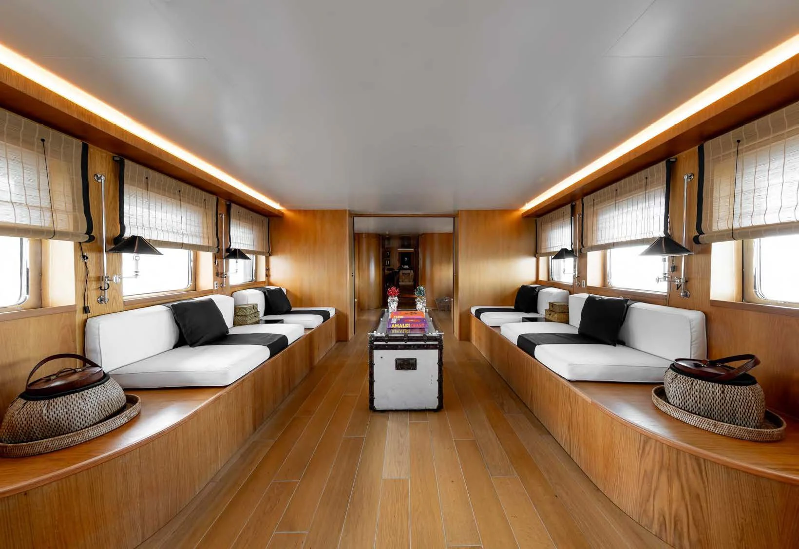 a living room with a large bed aboard SOUNION II Yacht for Sale